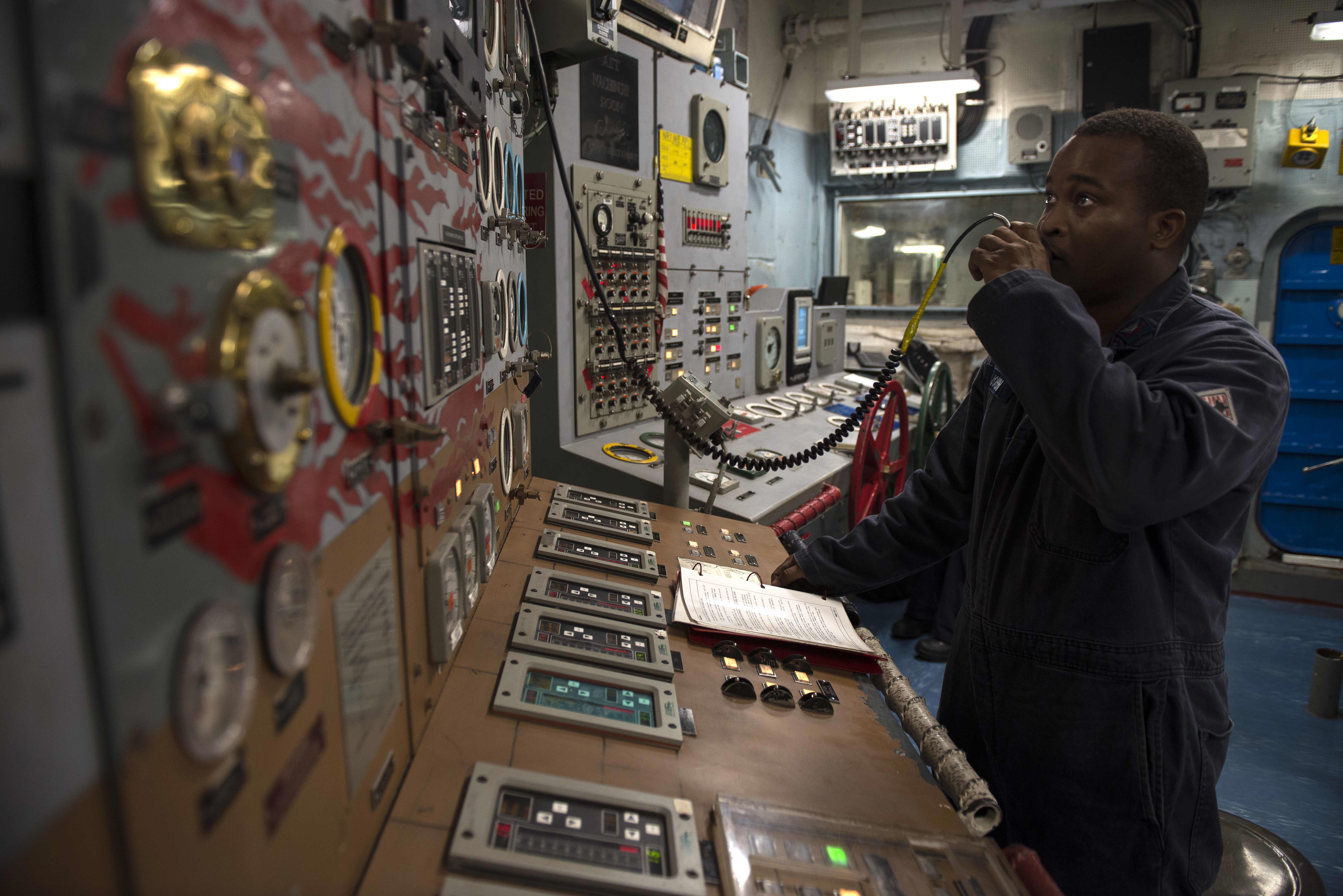 Sailor stands watch in the aft machinery room of USS Iwo Jima. (35298984822)
