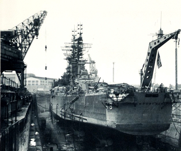 USS Newport News (CA-148) in drydock at the Norfolk Navy Yard 1965