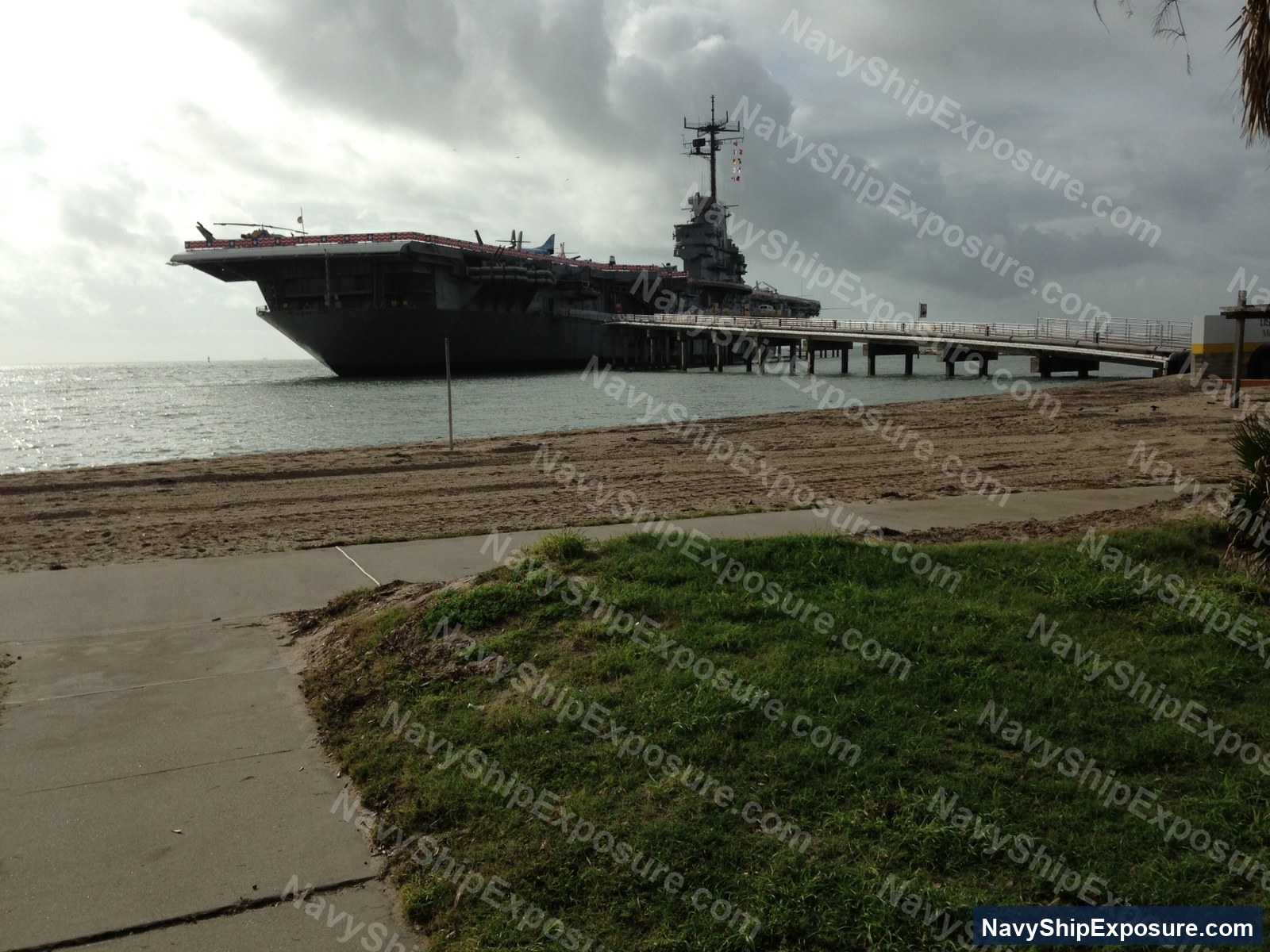 Aircraft carrier moored at pier