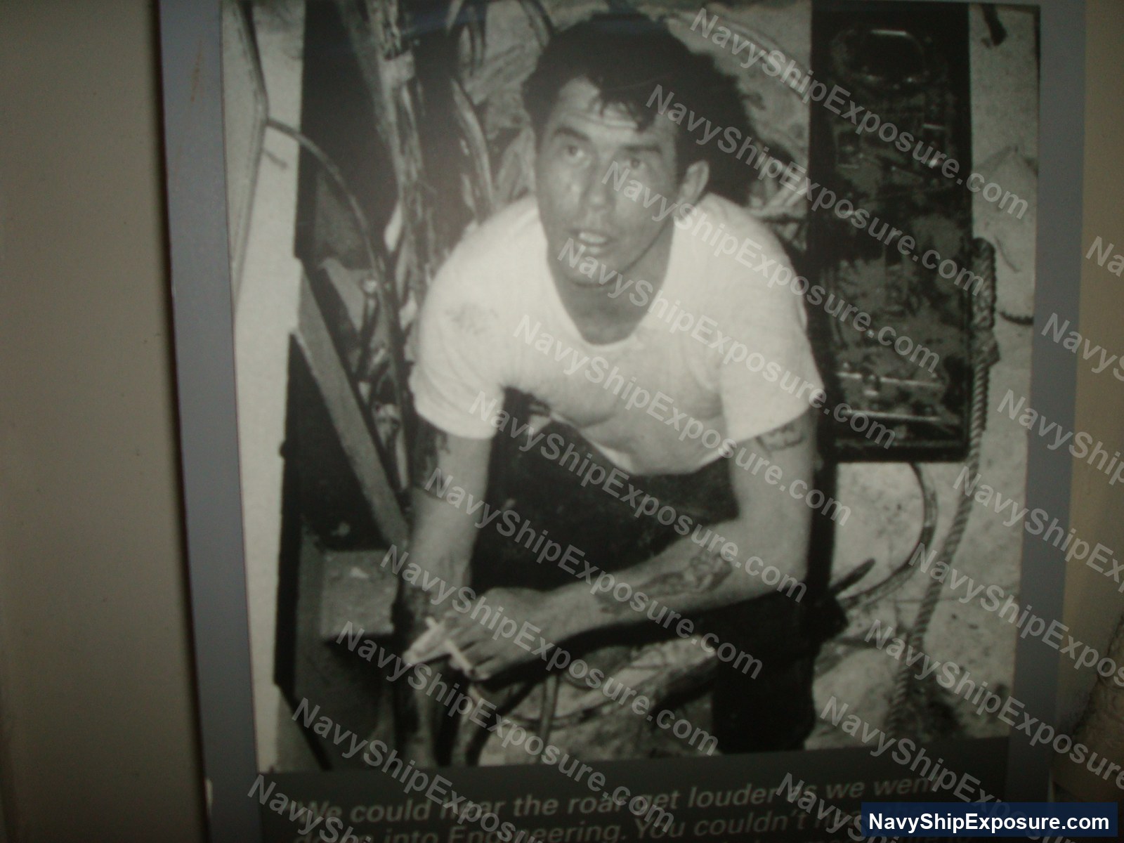 A sailor in the boiler room of USS Midway (CV-41) standing among high-temperature machinery and steam pipes, demonstrating the engineering spaces where asbestos insulation was commonly used.