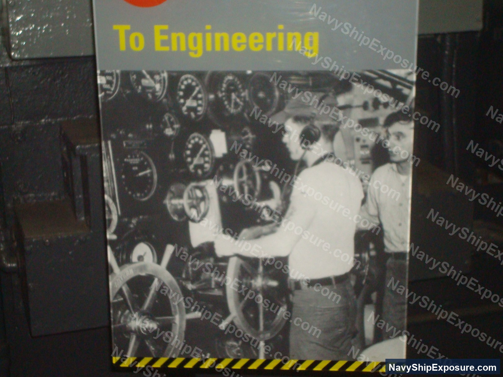 Historical black and white photograph showing engineering personnel operating machinery controls and gauges in an engine room or machinery space aboard USS Midway, typical of 1940s-era naval vessel propulsion systems that commonly contained asbestos insulation.